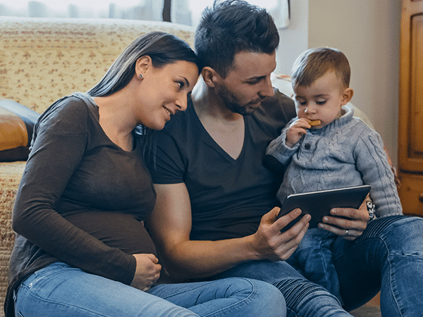 a family of three sitting together