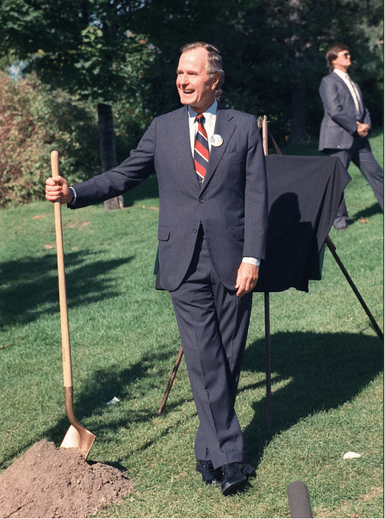 President George H.W. Bush prepares to plant a sapling from the White House at Spokane’s Riverfront Park in 1989