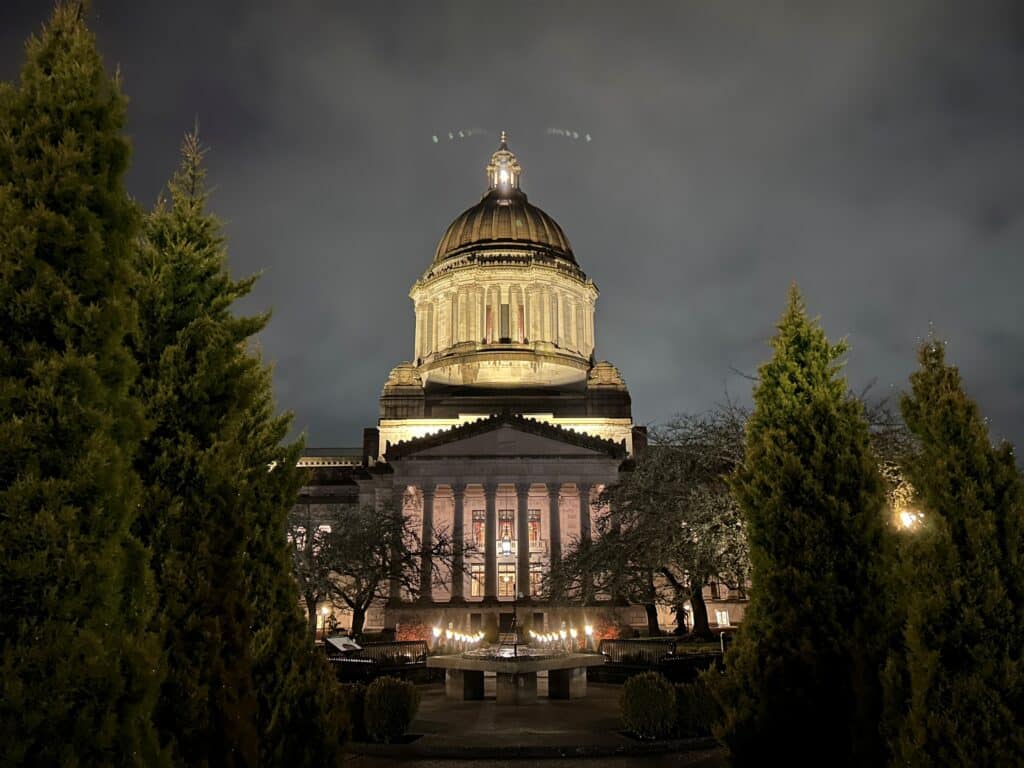 Photo of the Capitol Building in Olympia, Washington, shot from the side, in the early morning before the sunrise from February 2025.